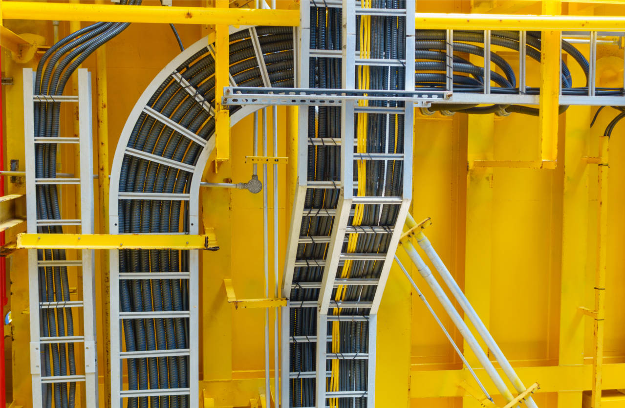 Cable tray with electrical wiring arrange on ceiling at offshore platform.